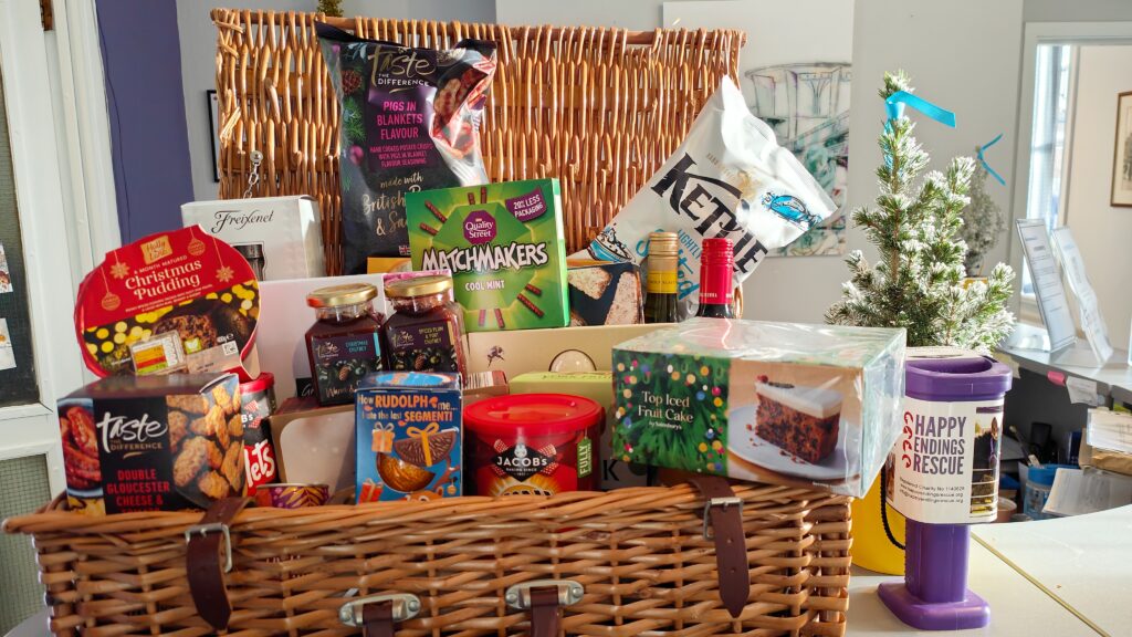 Wicker hamper with food and and festive goodies. 