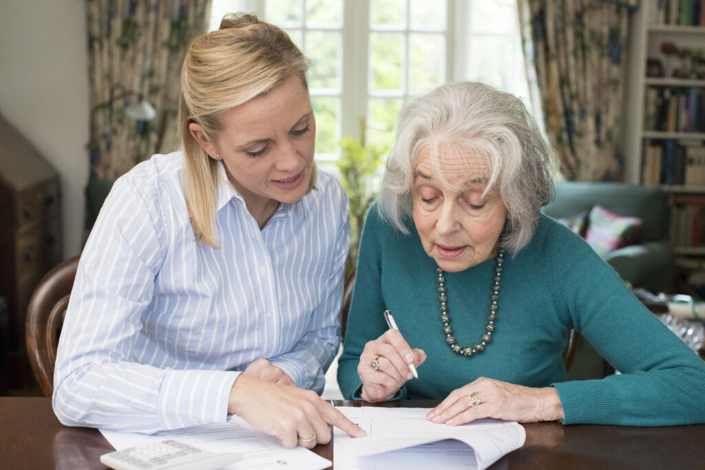 Mother and daughter completing paperwork.